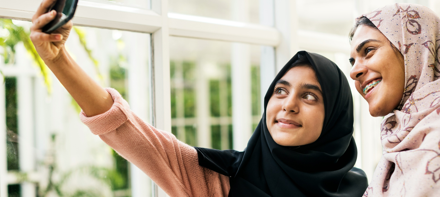 Curated lifestyle photo of two women taking a selfie